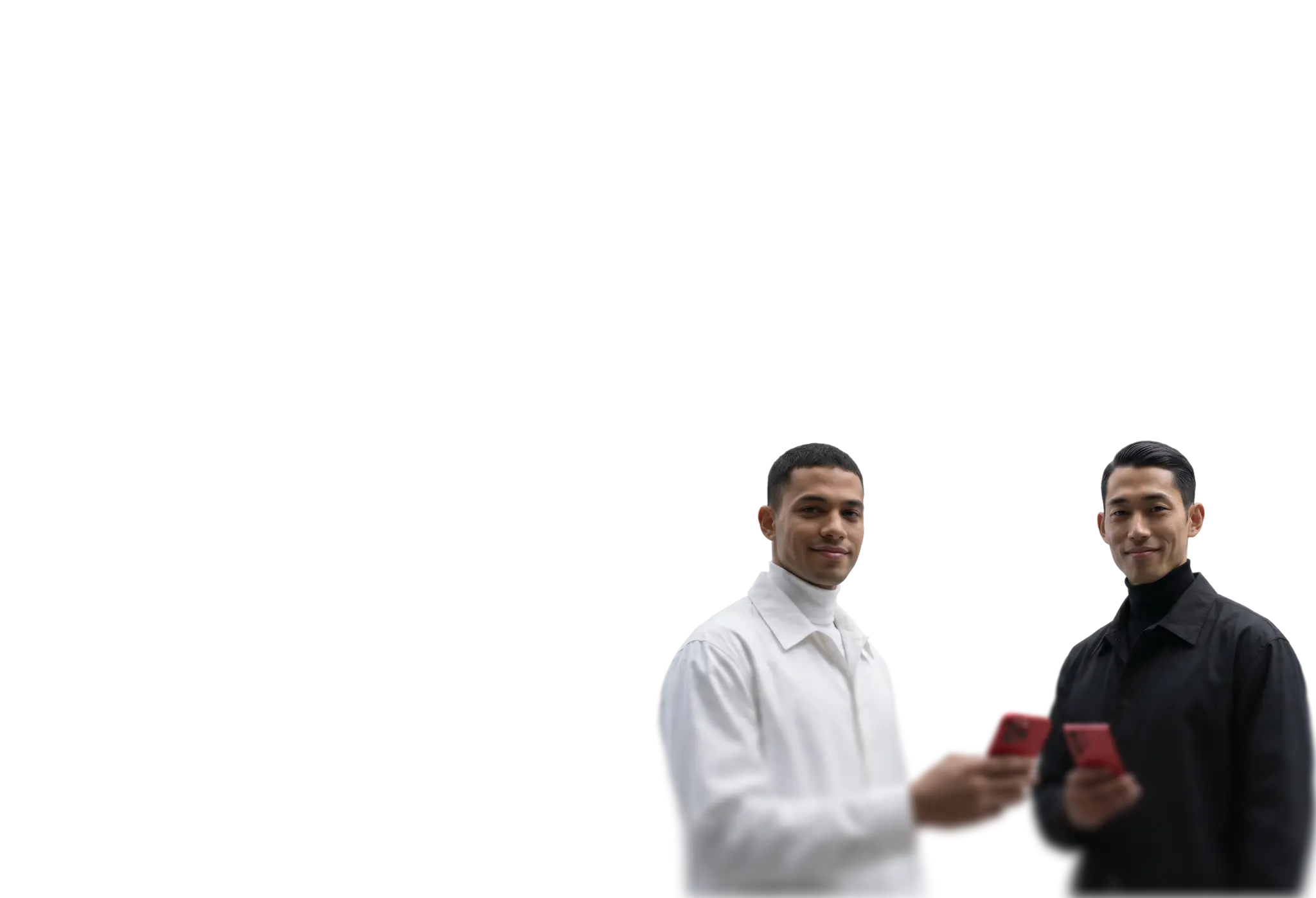 two people holding smartphones, representing mobile trading and connected investing